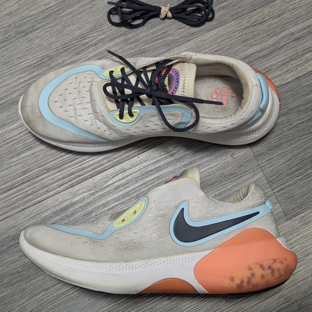 Nike Cream Athletic Shoes with Orange and Blue Accents